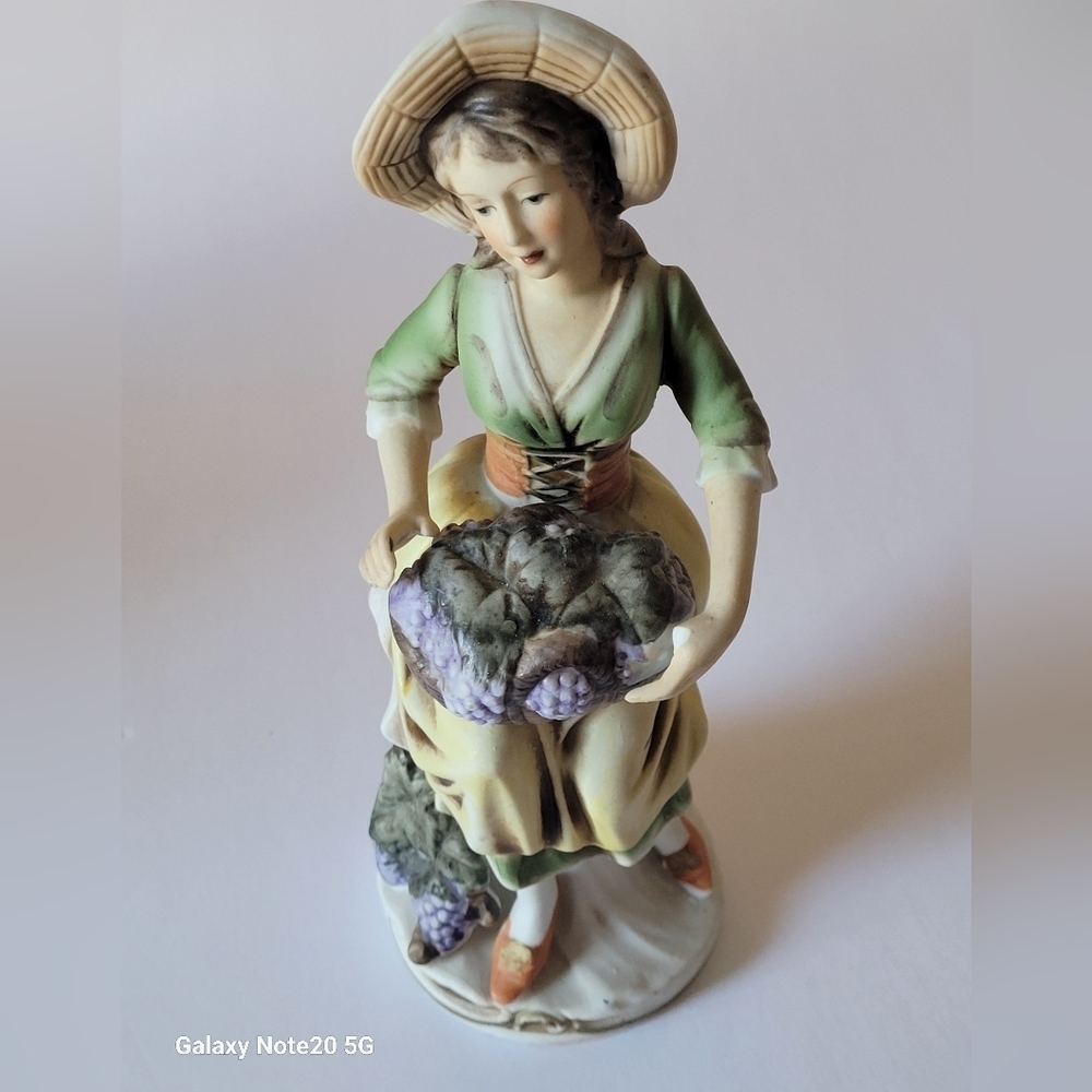 VINTAGE  girl holding grapes bisque porcelain figurine